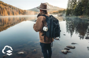 Photo of backpacker near lake with logo in the corner
